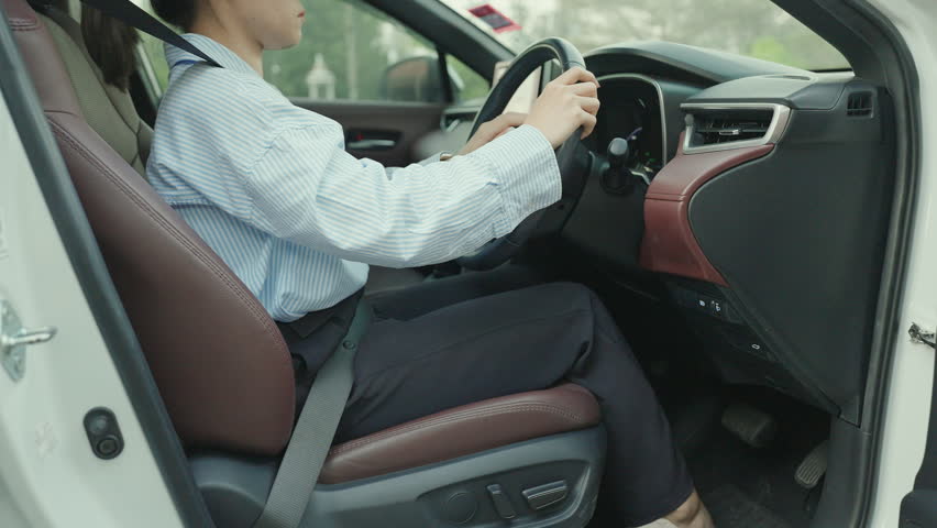 woman with her back sprain while driving car long time, back body ache due to Piriformis Syndrome, Low Back Pain and Spinal Compression. Ergonomic and medical concept