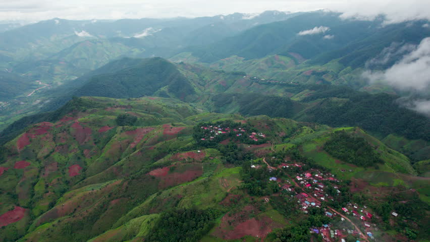 green forrest and mountain .Top view of countryside road passing through the 
