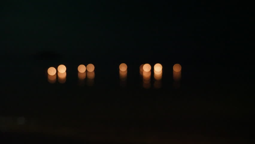 Majestic Loy Krathong ritual in Thailand with illuminated flowers arrangements floating, tradition where beautiful floral offerings glow on water. Blessings, gratitude and devotion in Thai faith.