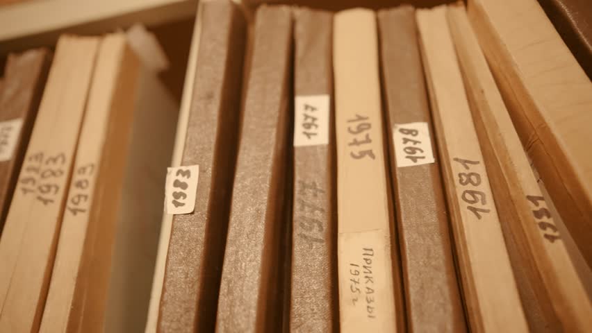 Old Document In Archive Department. Archival Material. Bookkeeping File Shelf. 
Archive Texts In Films And Reports. Highly Classified Documents. National Archives Records. Old Secret Archival Document