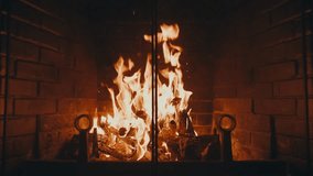 Warm Glow From Firewood Burning In Fireplace. static shot, slow motion - Powered by Shutterstock - Get 15% off with code: PIKWIZARD15