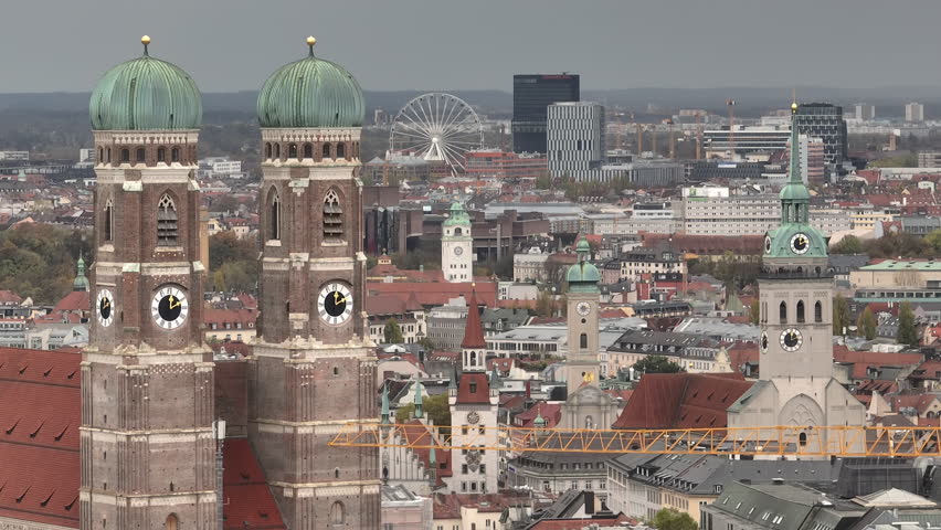 cloudy day munich cityscape famous central church towers exterior aerial panorama 4k germany
