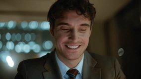 Night businessman hands messaging cellphone browsing app at office closeup. Smiling man tapping smartphone screen watching content. Happy manager surfing internet by mobile phone sitting at dark room - Powered by Shutterstock - Get 15% off with code: PIKWIZARD15