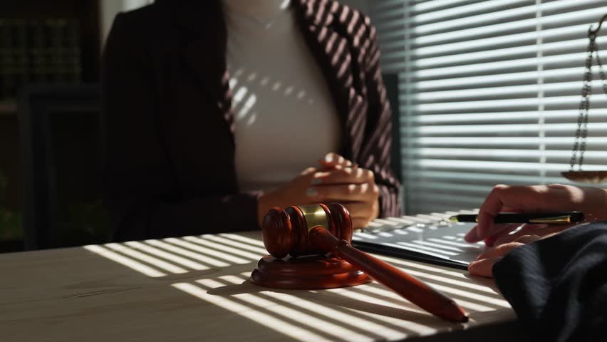 Professional businesswoman experiencing intense moment during client consultation. Receiving distressing legal information inside courtroom. Reflecting complex legal interaction and workplace stress