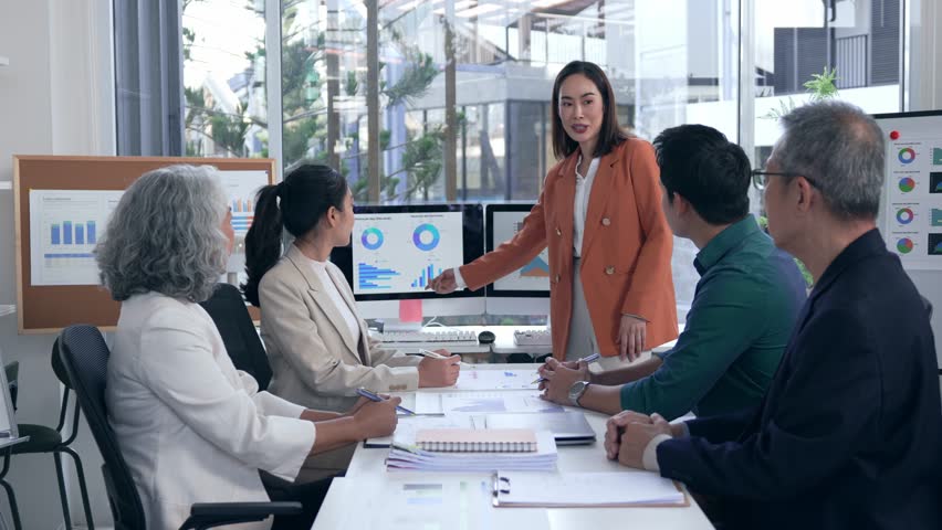 Professional business team celebrating collaborative success, sharing high fives and applause after impressing colleagues with compelling presentation in modern workplace setting