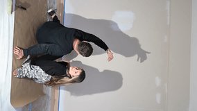 A couple creates shadow figures of animals on the ceiling during a fun break in renovation. - Powered by Shutterstock - Get 15% off with code: PIKWIZARD15