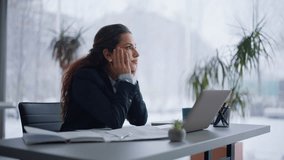 Closeup woman worker thinking on work deadline sitting light workplace. Tired businesswoman pondering project issues looking panoramic window. Unmotivated manager feeling overworked at coworking room - Powered by Shutterstock - Get 15% off with code: PIKWIZARD15