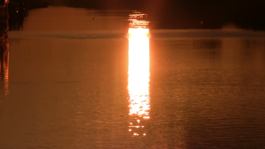 Dawn on the river, sun reflection, tranquil scene