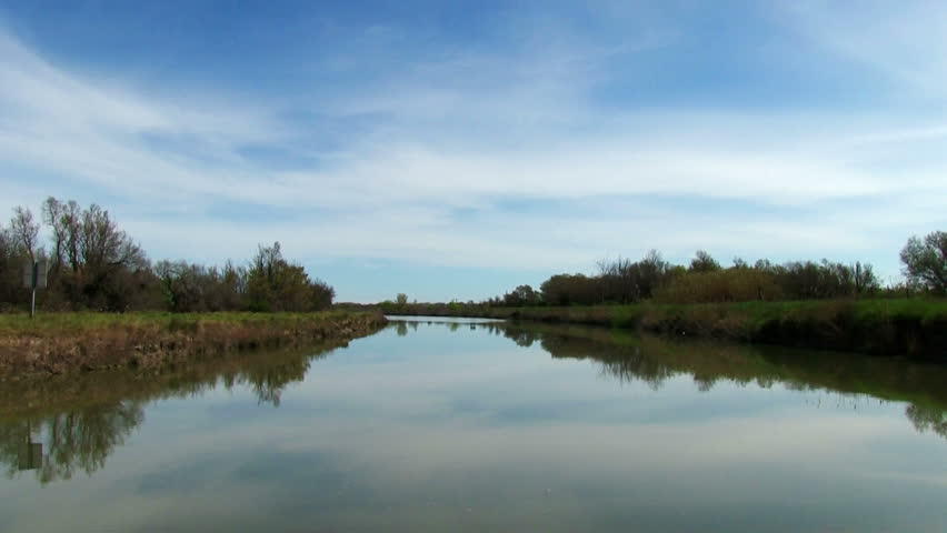 Vessel sails on the canal in nature, timelapse