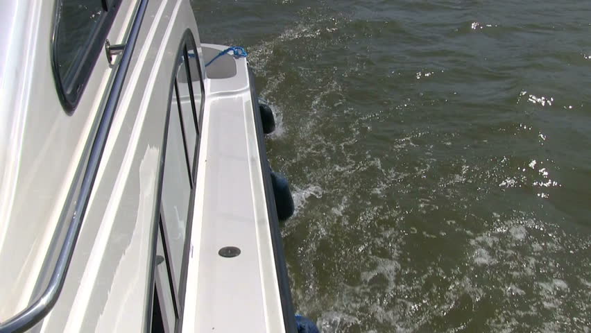 Vessel sails on the canal, side view