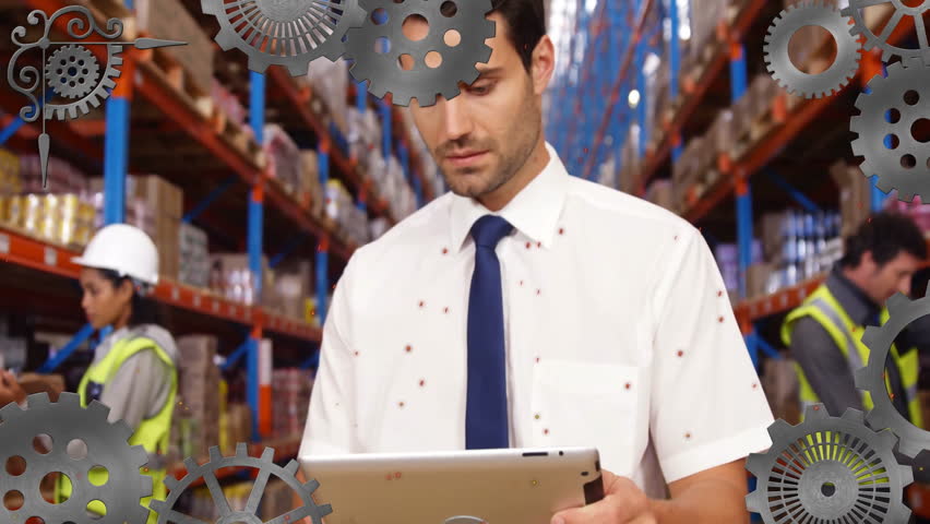 In warehouse, worker using tablet with animation of gears overlaying scene. Logistics, technology, innovation, efficiency, automation, management - Powered by Shutterstock - Get 15% off with code: PIKWIZARD15