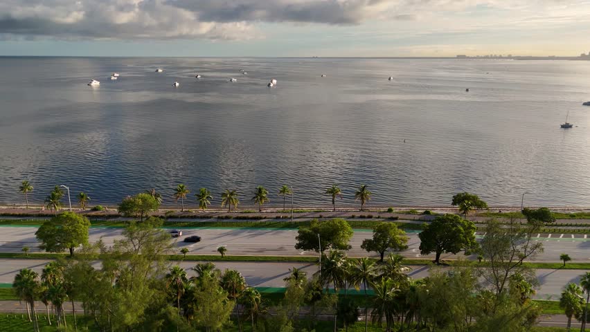 Aerial video of boats in ocean over the view of Downtown Miami from Virginia Key, Miami, Florida, USA