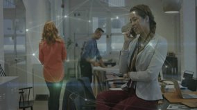 Businesswoman on phone in office with network connections animation overlay. communication, technology, networking, innovation, virtual, digital - Powered by Shutterstock - Get 15% off with code: PIKWIZARD15