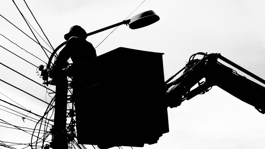 Silhouette of an electrician to repair street lighting on white background.
