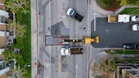 Aerial Shot of Road Construction Crew Working in an Urban Area - Powered by Shutterstock - Get 15% off with code: PIKWIZARD15