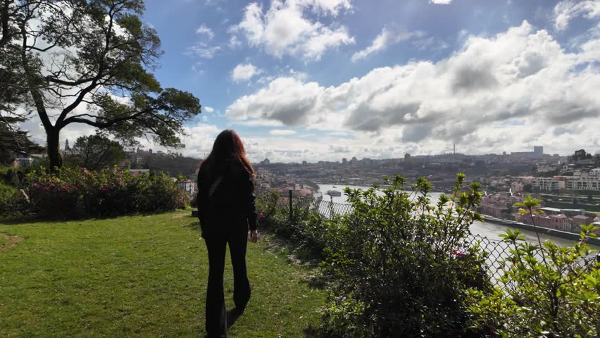 Slowmotion of girl in Jardins do Palácio de Cristal park in Porto