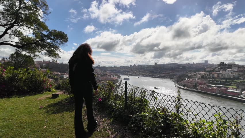 Slowmotion of girl in Jardins do Palácio de Cristal park in Porto