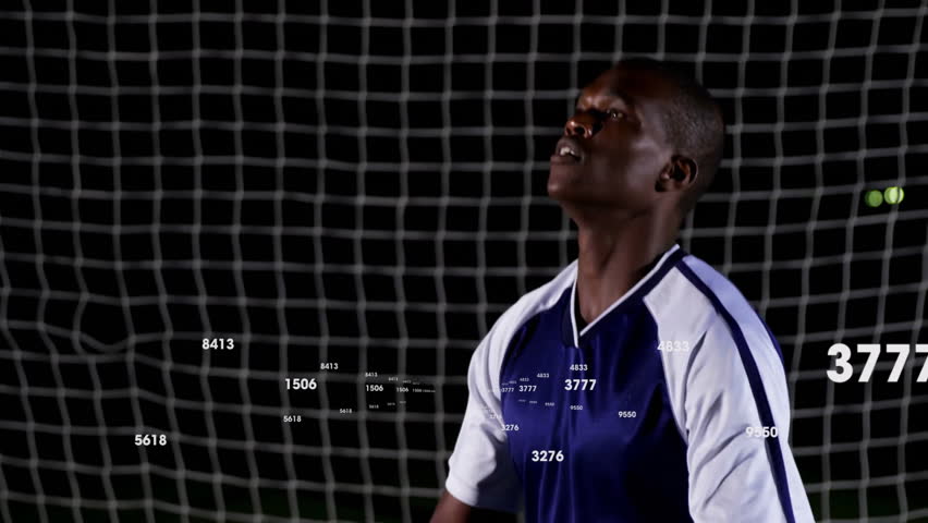 Standing in front of goal, soccer player with animation of numbers overlay. athlete, technology, data, analytics, digital, sport - Powered by Shutterstock - Get 15% off with code: PIKWIZARD15
