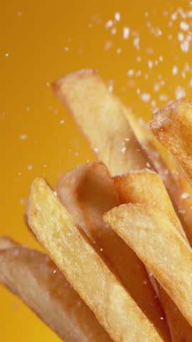Super Slow Motion Detail Shot of adding Salt on Fresh French Fries at 1000fps