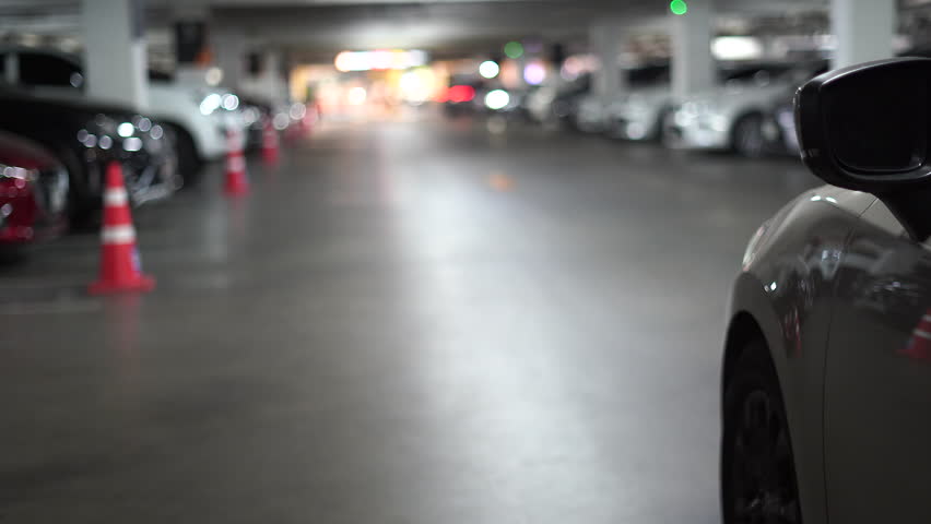 Cars are leaving the underground parking lot.