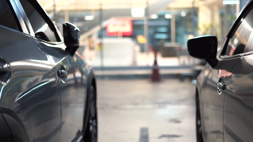 Cars are leaving the underground parking lot.