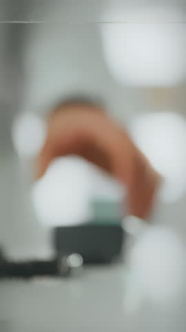 A pharmacist applies expertise to process a payment in a drug store. The interaction takes place at the checkout counter, highlighting the importance of technology in everyday transactions