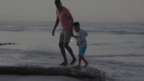 Father and son walking on beach with network connections animation overlay. Family, bonding, technology, digital, future, outdoors - Powered by Shutterstock - Get 15% off with code: PIKWIZARD15