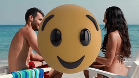 Relaxing on beach, man and woman with large winking emoji animation overlay. Vacation, relaxation, ocean, seaside, tropical, leisure - Powered by Shutterstock - Get 15% off with code: PIKWIZARD15