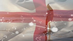 Walking on beach, woman holding England flag with molecular structure animation. Vacation, patriotism, technology, science, travel, nationality - Powered by Shutterstock - Get 15% off with code: PIKWIZARD15