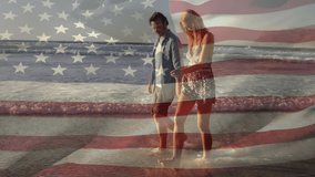 Walking on beach, couple with American flag animation in background. Patriotism, romance, celebration, travel, vacation, holiday - Powered by Shutterstock - Get 15% off with code: PIKWIZARD15
