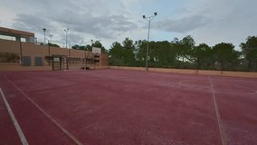 Come and explore a contemporary outdoor basketball court, beautifully set amidst lush greenery and captivating skies - Powered by Shutterstock - Get 15% off with code: PIKWIZARD15