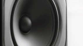 Large speaker pulsating hard. Speaker cone close up - Powered by Shutterstock - Get 15% off with code: PIKWIZARD15
