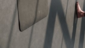 Vertical video. Yoga group. Aerobic workout. Active people stepping barefoot on sport mat before star pilates class training session with female fitness coach in gym studio indoors. - Powered by Shutterstock - Get 15% off with code: PIKWIZARD15