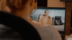 Woman participates in a business video call while working from home. She discusses tasks and communicates with her colleague through the laptop screen. - Powered by Shutterstock - Get 15% off with code: PIKWIZARD15