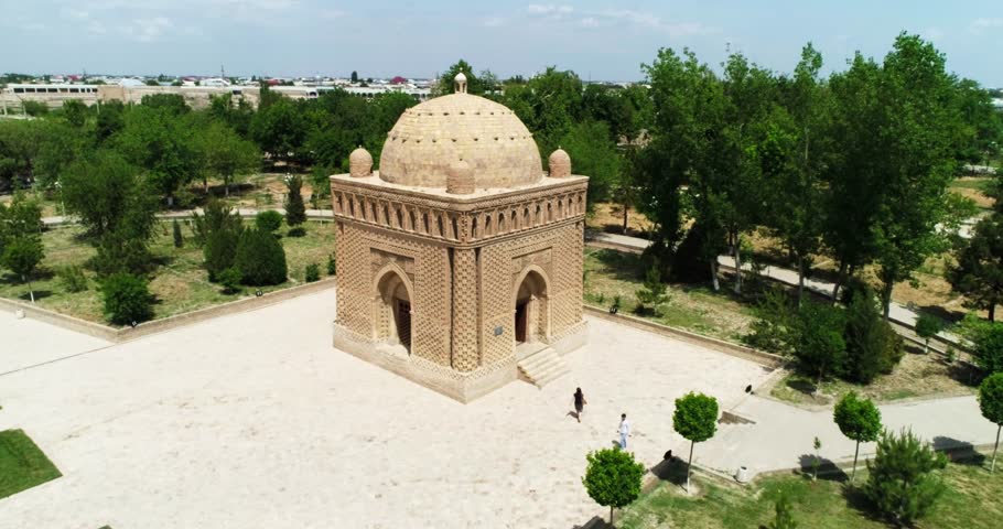Drone flies around Ismoil Somoniy madrasah on a sunny day. Uzbekistan, Bukhara.