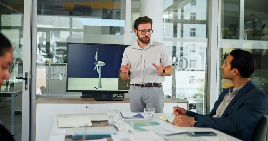 Presentation, business people and man with windmill in office for sustainability, innovation and renewable energy. Climate change, power farm and workers with wind turbine for electricity production