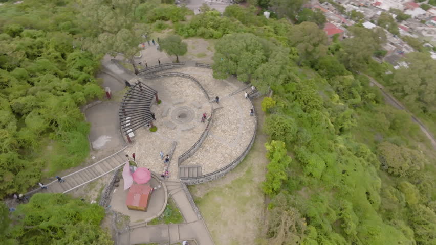 Group of people resting at a beautiful viewpoint on San Miguel Hill in the Mexican town of Atlixco