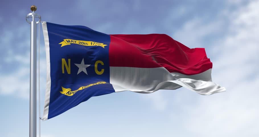 North Carolina state flag waving. North Carolina is a state in the Southeastern region of the United States. Rippled fabric. Seamless 3d render animation. Slow motion loop. Selective focus