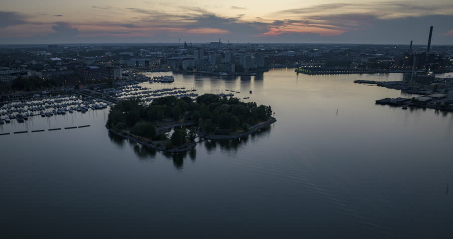 Aerial hyperlapse of Tervasaari, Pohjoisranta and the cityscape of Helsinki, dusk