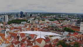 3D animation of a handcrafted, colourful paper bird with a love message flying over a city view. - Powered by Shutterstock - Get 15% off with code: PIKWIZARD15