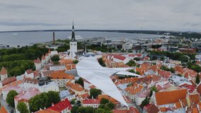 3D animation of a handcrafted, colourful paper bird with a love message flying over a city view. - Powered by Shutterstock - Get 15% off with code: PIKWIZARD15