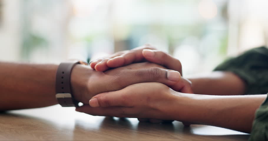 Comfort, holding hands or empathy and people in home together with support for grief, loss or pain. Forgiveness, love and trust with friends closeup in apartment for compassion, help or patience