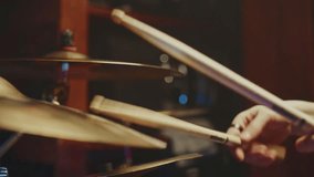 A skilled drummer passionately plays the cymbals and drums in a vibrant recording studio. The energy of the music fills the room as the performance unfolds, showcasing talent and creativity. - Powered by Shutterstock - Get 15% off with code: PIKWIZARD15