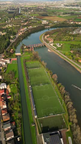 drone above video of green turth football field with no people players 