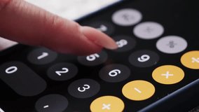 Person counts on a calculator of smartphone. Woman counting accounting bills on phone. - Powered by Shutterstock - Get 15% off with code: PIKWIZARD15