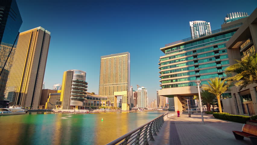 sunny evening dubai city marina walking bay pov panorama 4k timelapse uae