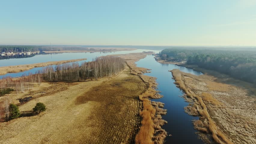 Sunrise over river delta, marshland landscape near Jurmala coast, peaceful scene