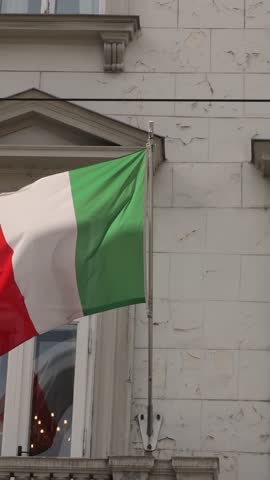 Italian flag on a building in Europe.