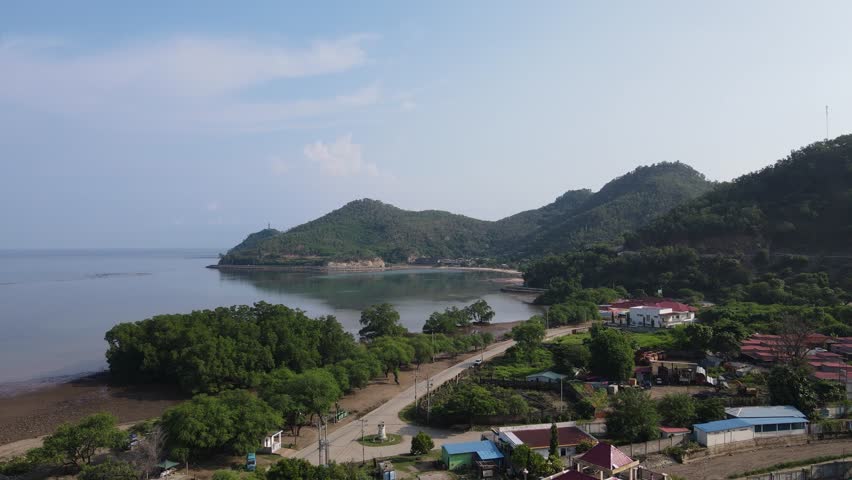 The beauty of Christo Rei Beach and Fatucama Hill seen from a height, one of the most famous tourist destinations in Dili City, Timor Leste.