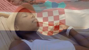 Relaxing in hammock on tropical beach, animation of Croatian flag overlaying. vacation, sea, travel, summer, coastline - Powered by Shutterstock - Get 15% off with code: PIKWIZARD15